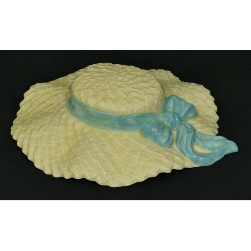 4249 - A Falcon Ware Art Deco style wall pocket in form of a hat, 26cm high, 22.5cm wide.