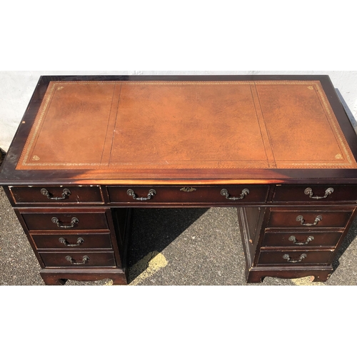 4030 - A reproduction mahogany knee hole double pedestal desk with brown leather inset top, centre drawer f... 