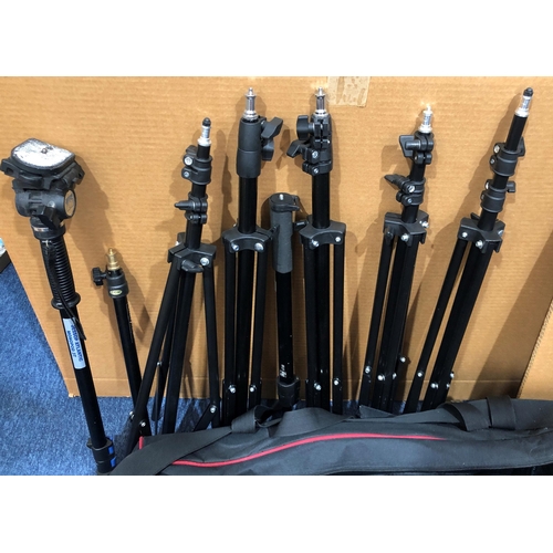 4033 - A quantity of camera equipment including tripods, bulbs, light filters, 3 x Neewer C-180 photo flash... 