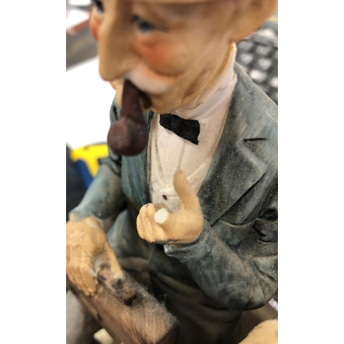 4034 - A 20th Century painted porcelain Capodimonte figure, Tramp feeding a squirrel bearing impressed B.Me... 