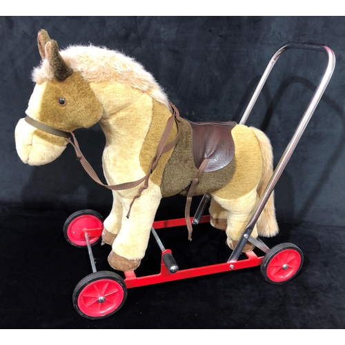 4042 - A Merrythought push along donkey walker 53cm wide, 53.5cm high overall.