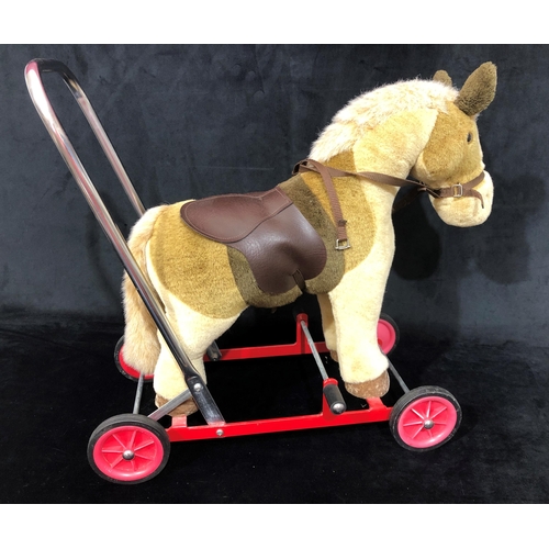 4042 - A Merrythought push along donkey walker 53cm wide, 53.5cm high overall.