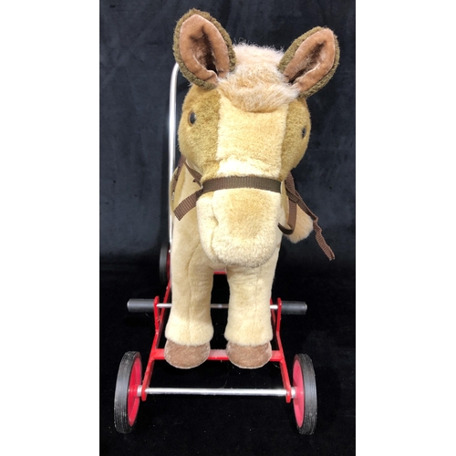 4042 - A Merrythought push along donkey walker 53cm wide, 53.5cm high overall.