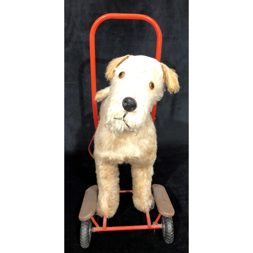 4043 - A child's Tri-Ang style vintage push-a-long dog, 49cm wide, 60cm high. (Fur to top worn)