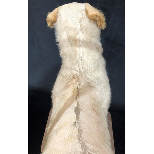 4043 - A child's Tri-Ang style vintage push-a-long dog, 49cm wide, 60cm high. (Fur to top worn)