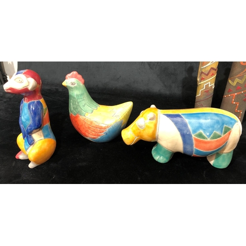 4055 - A collection of handmade South African animals with multi-coloured glaze, rhinoceros, 2 elephants, m... 