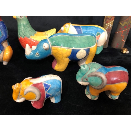 4055 - A collection of handmade South African animals with multi-coloured glaze, rhinoceros, 2 elephants, m... 