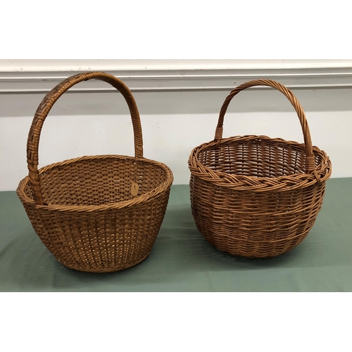 4064 - 2 wicker baskets, tallest 47cm high, 35cm diameter. (2)