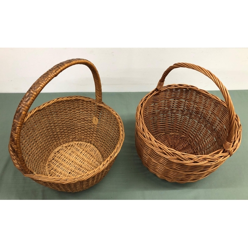 4064 - 2 wicker baskets, tallest 47cm high, 35cm diameter. (2)