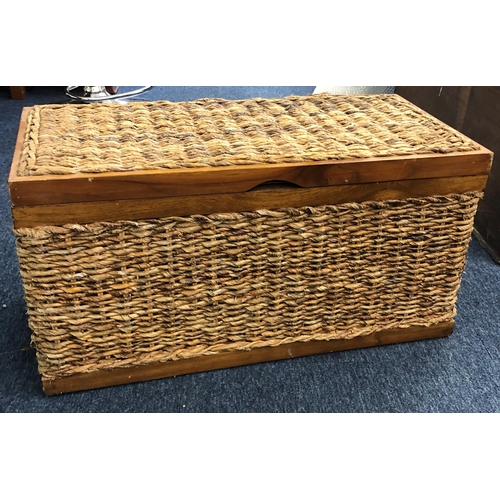 4077 - A wood and wicker trunk with 2 metal handles and interior linen liner, 66cm wide, 33cm deep, 33.5cm ... 