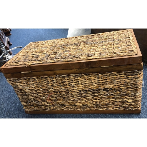 4077 - A wood and wicker trunk with 2 metal handles and interior linen liner, 66cm wide, 33cm deep, 33.5cm ... 