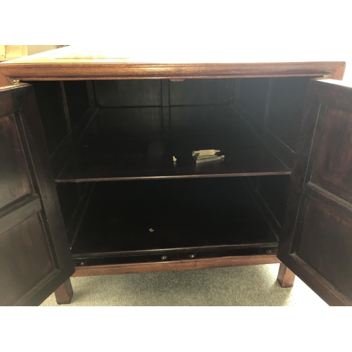 4099 - A low cabinet with 2 panel doors enclosing 1 shelf, brass handle and lock fittings (some loose brass... 