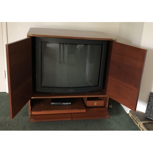 4100 - A campaign style modern TV cabinet with brass detail and handles, double door to front enclosing TV ... 