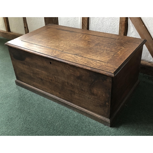 4111 - A good quality oak trunk with hinged lid enclosing open storage to interior, (no key, slight rubs an... 