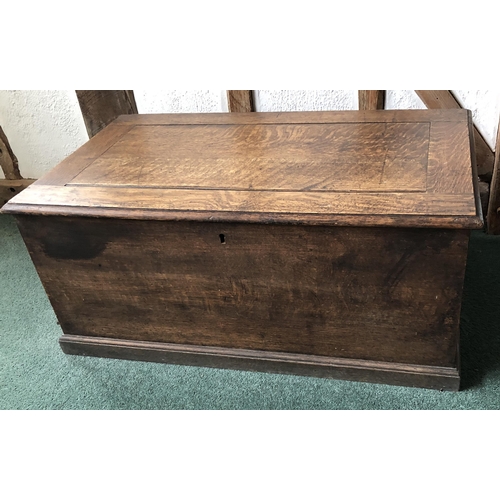 4111 - A good quality oak trunk with hinged lid enclosing open storage to interior, (no key, slight rubs an... 