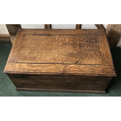 4111 - A good quality oak trunk with hinged lid enclosing open storage to interior, (no key, slight rubs an... 