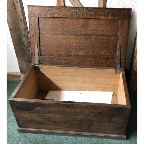 4111 - A good quality oak trunk with hinged lid enclosing open storage to interior, (no key, slight rubs an... 