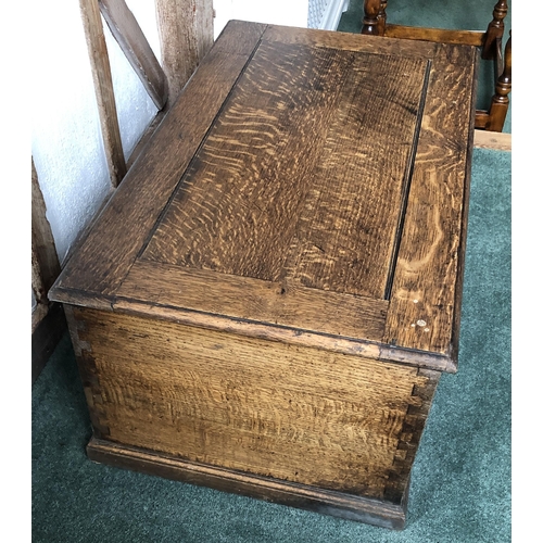 4111 - A good quality oak trunk with hinged lid enclosing open storage to interior, (no key, slight rubs an... 