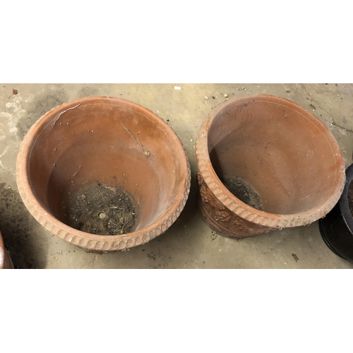 4113 - A pair of terracotta garden pots with shell and grape decoration to sides, 48cm diameter, 42.5cm hig... 