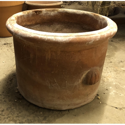 4114 - A single terracotta circular based garden pot with shell shaped handles, 48cm diameter, 36.5cm high.... 