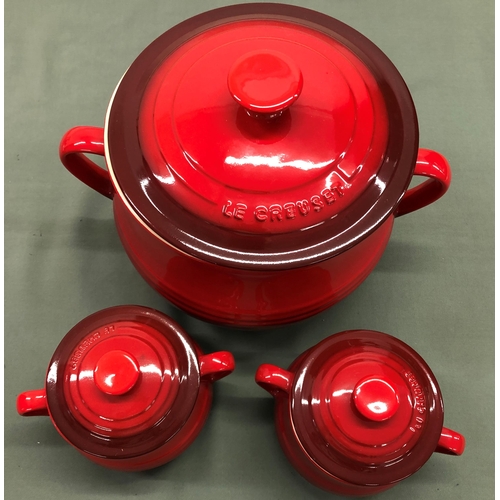 4122 - A large red Le Creuset 2-handled soup pot with lid and 6 matching 2-handled individual soup pots wit... 