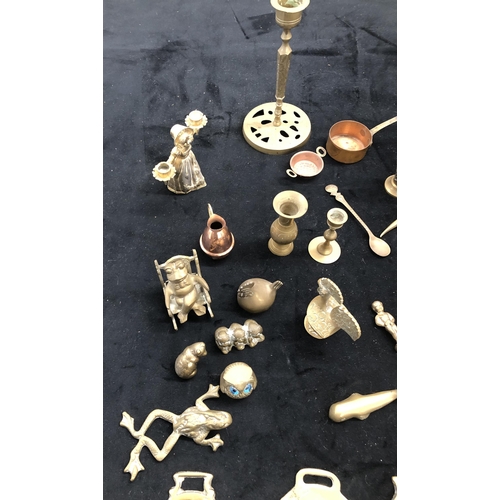 4125 - A quantity of mixed brass including a teapot, small animal ornaments, bell, candlestick etc.