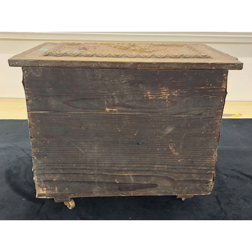 4133 - A wooden coal box with beaten copper panels to sides and top, hinged lid enclosing open storage area... 