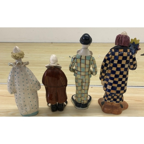 4024 - Elizabeth Haslam ceramic figure of a clown holding flowers, 31cm high and 3 similar figures of clown... 