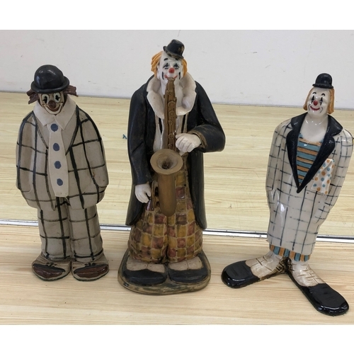 4025 - Elizabeth Haslam handcrafted ceramic figure of a clown playing a saxophone, 29cm high and 2 other fi... 