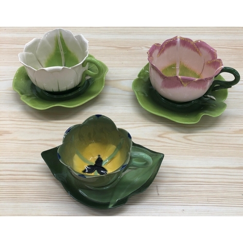 4028 - 3 South African Mustard Seed Moonshine cups and 3 saucers. (Chip to 1 petal on pink cup)