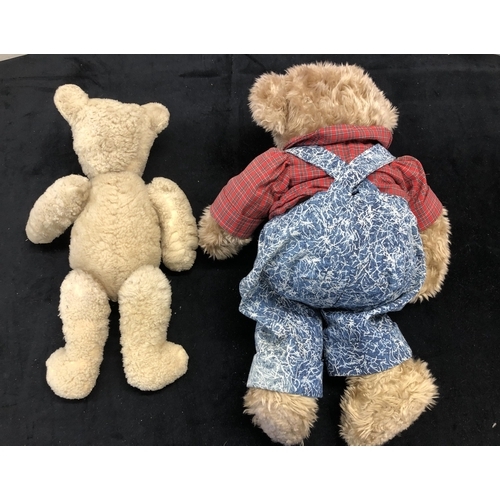 4120 - A Teddy Bear wearing a pair of blue dungarees ad red check shirt, 52cm tall, Russ Berry UK Ltd label... 