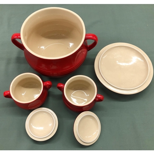 4122 - A large red Le Creuset 2-handled soup pot with lid and 6 matching 2-handled individual soup pots wit... 