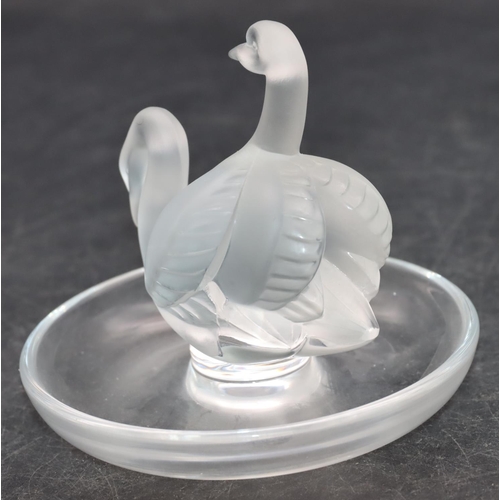 100 - A Lalique frosted glass ring dish with 2 swan motifs on round base, 10cm diameter, 9cm high