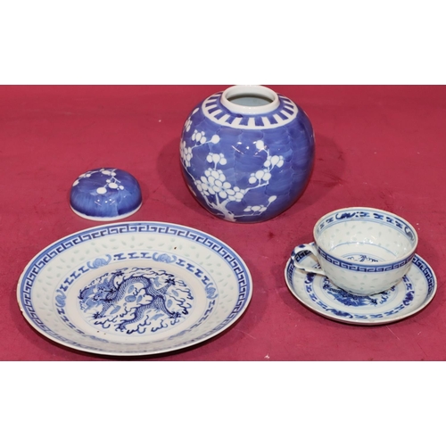 103 - An Oriental blue and white trio of cup, saucer and side plate with dragon decoration and a blue and ... 