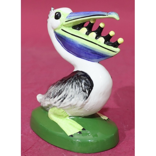 12 - A Lorna Bailey Art Deco style china figure of a pelican with bottles in its mouth, stamped to base 