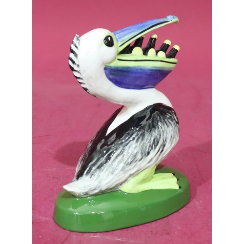 12 - A Lorna Bailey Art Deco style china figure of a pelican with bottles in its mouth, stamped to base 