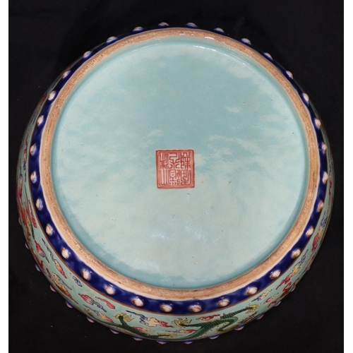 130 - A Chinese Tao-Kuang period round bulbous shaped bowl on pale turquoise ground with multi-coloured dr... 