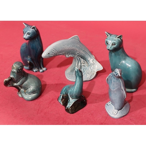 15 - A Poole figure of a leaping trout on blue ground, 12.5cm high, 2 Poole figures of seated cats on blu... 