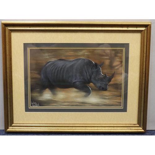 164 - Nicholas Ruston, pastel, depicting charging rhino, signed and dated '96, 20cm x 32cm, in gilt frame,