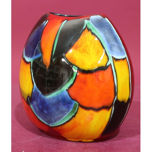 19 - A Poole oval bulbous shaped vase on vibrant red, blue, yellow and orange ground, 19cm high