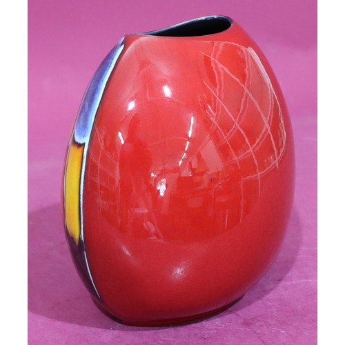 19 - A Poole oval bulbous shaped vase on vibrant red, blue, yellow and orange ground, 19cm high