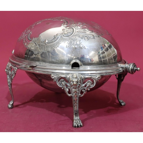 217 - A silver plated oval egg shaped breakfast dish with revolving top enclosing liner on 4 splayed claw ... 