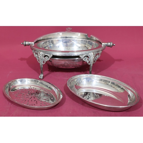 217 - A silver plated oval egg shaped breakfast dish with revolving top enclosing liner on 4 splayed claw ... 