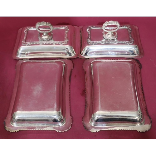 218 - A pair of silver plated rectangular entrée dishes with cover and raised shell, leaf and gadroon rims... 