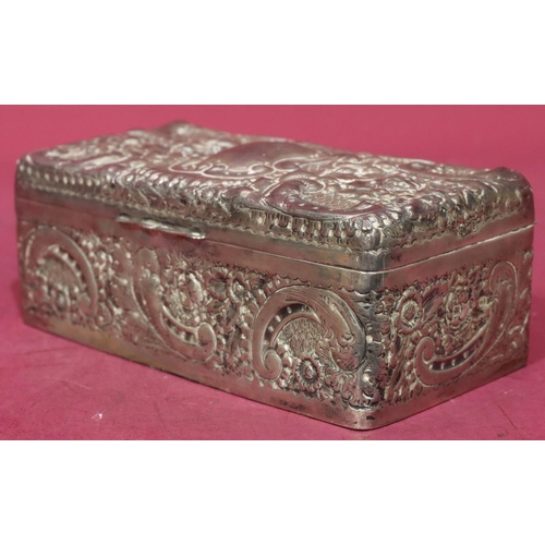 227 - A Victorian silver rectangular shaped cigarette box with allover embossed floral, leaf and scroll de... 