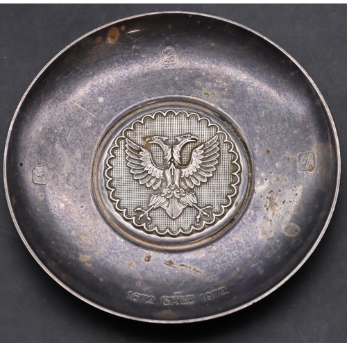 229 - A silver small round dish inset with double-headed eagle motif to centre, maker's mark CM Co., 9.2cm... 