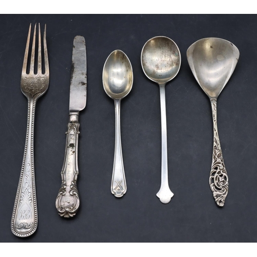 231 - A Victorian London silver fork, a 900 silver coloured metal jam spoon, 2 silver teaspoons and a butt... 