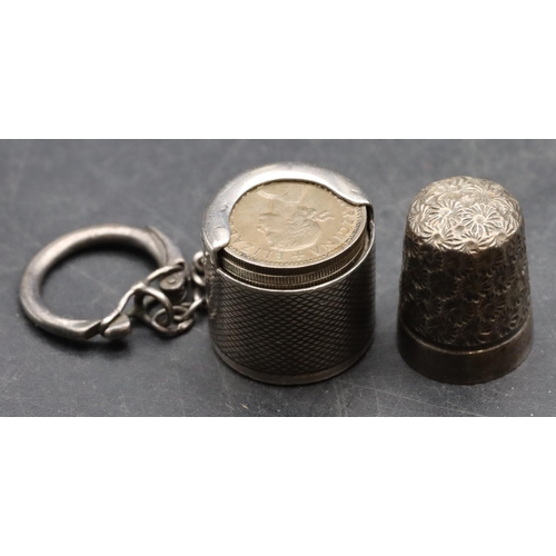 234 - A Birmingham silver coin holder with engine turned decoration mounted with keyring holding 11 variou... 