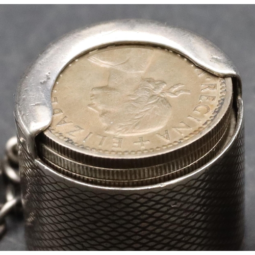 234 - A Birmingham silver coin holder with engine turned decoration mounted with keyring holding 11 variou... 