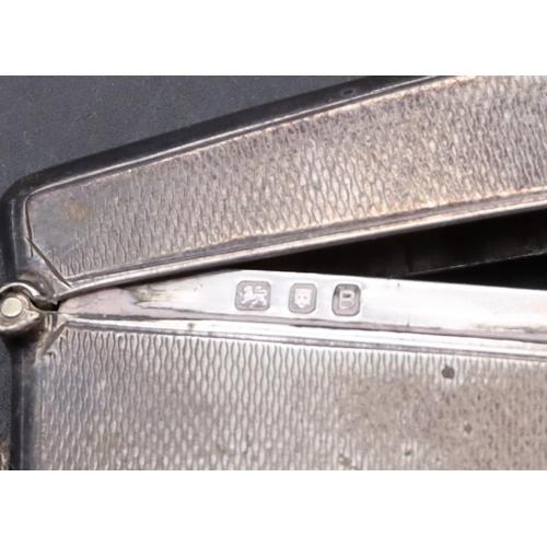 237 - A London silver concaved shaped card case with hinged top and engine turned decoration, 1.3oz 9cm lo... 